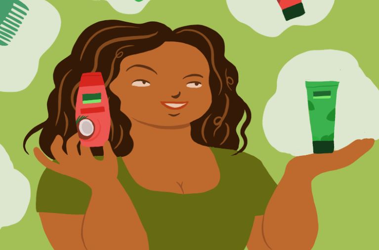 a woman with curly beautiful hair holding Palmolive shampo 